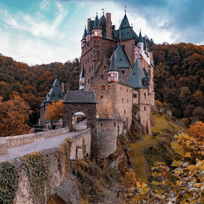 Castle Eltz looming from the German mountainside at sunset.